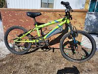 Side view of Nakamura kids bicycle showing frame, wheels, suspension fork and overall condition