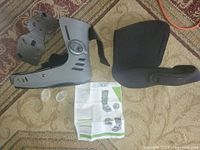 Boot shell, liner, air bladders, instructions displayed on carpet