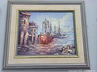 Front view of framed harbor scene oil painting