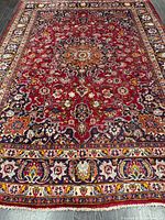 Full view of Persian rug showing pattern and borders