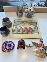 Group shot showing all pottery, print, beadwork, carvings