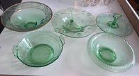 All five green glass pieces displayed