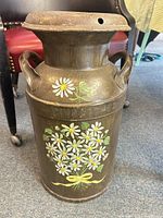 Full view of milk can showing painted daisies, handles, and embossed CHICAGO-50