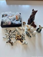 Lot overview showing boxed and loose animal figurines