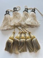 Group view of all nine tassels showing size and color difference