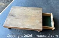 Top view of wooden chopping block with drawer extended