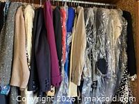 Clothing on hangers, variety of jackets and coats