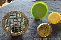 Cylindrical cage frog and three pin frogs showing bases and wear