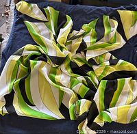 Entire scarf showing geometric green, yellow, white, black pattern