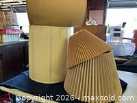 Group view of four vintage lampshades
