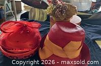 Group shot of three hats on table