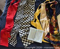 Group of seven assorted scarves laid out