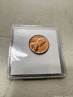 Obverse of 1961-D Lincoln cent in flip