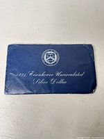 Front of blue Treasury envelope labeled 1971 Eisenhower Uncirculated Silver Dollar