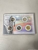 Front view of sealed 2004 Louisiana Purchase Nickel Collection showing five coins in holder