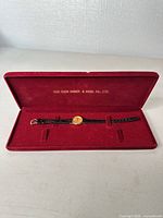 Watch in red presentation box, full view