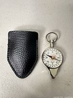 Compass and leather pouch front view