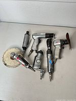 Top view showing all six pneumatic tools on table