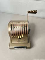 Front view showing denomination keys, logo, and condition