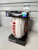 Boxed full-size 49ers football front view showing autograph panel in packaging