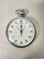 Front view of Security Swiss pocket stopwatch showing dial and hands