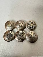 All six sterling silver geometric buttons front view