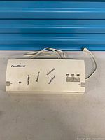 Top view of entire FoodSaver vacuum sealer with cord