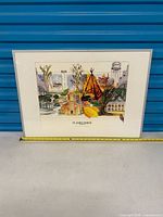 Full view of framed print with measuring tape showing width