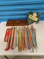 overview of all needles, case, unopened yarn skein