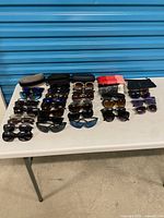 Tabletop view of all sunglasses and cases