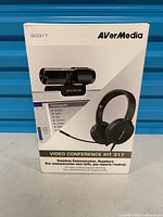 Front of AVerMedia Video Conference Kit 317 retail box showing headset and webcam images