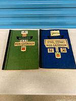 Front covers of both scrapbooks showing titles and colors