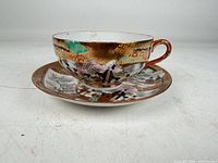 Cup on saucer showing full decoration