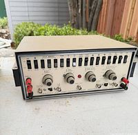 Front three-quarter view of Heathkit IG-57A showing switches, knobs and terminals