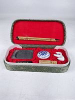 Box open showing all components arranged in red lining