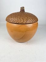 Front view of acorn-shaped jar with lid on