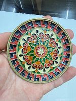 Front view of cloisonné brass plate showing full multicolor design