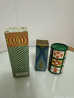 Three boxed Avon colognes standing side by side