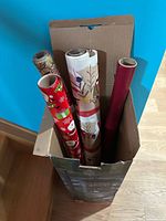 Top view of four wrapping paper rolls in box