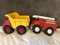 Fire truck and dump truck side by side