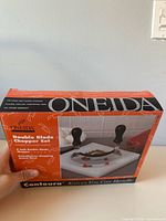 Front of Oneida Contoura double blade chopper set retail box