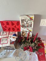 Group shot showing ornaments boxes, centerpiece, mould tray, napkins, bottle cover, collector plate