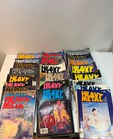 Spread of all Heavy Metal magazines laid out on table showing front covers