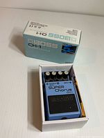 Pedal in open box with lid alongside