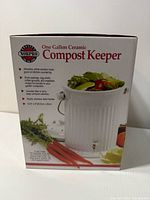 Front of box showing Norpro One Gallon Ceramic Compost Keeper branding and image