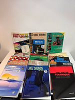 Group shot of all guitar books spread on table