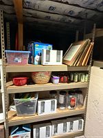 Overall view of metal shelving unit and contents