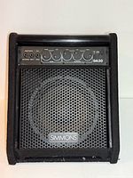 Front view showing Simmons DA50 amplifier, grille, logo and control panel