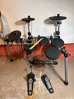 Front view of full Simmons SD500 kit showing pads, cymbals, rack, pedals and drumsticks