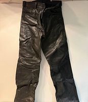 Full view of black leather motorcycle pants front side